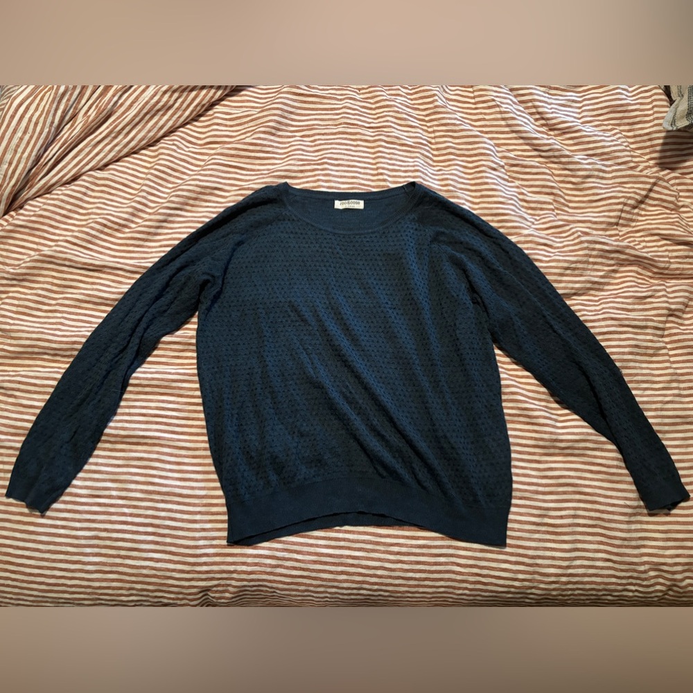 Blue long sleeve sweater.